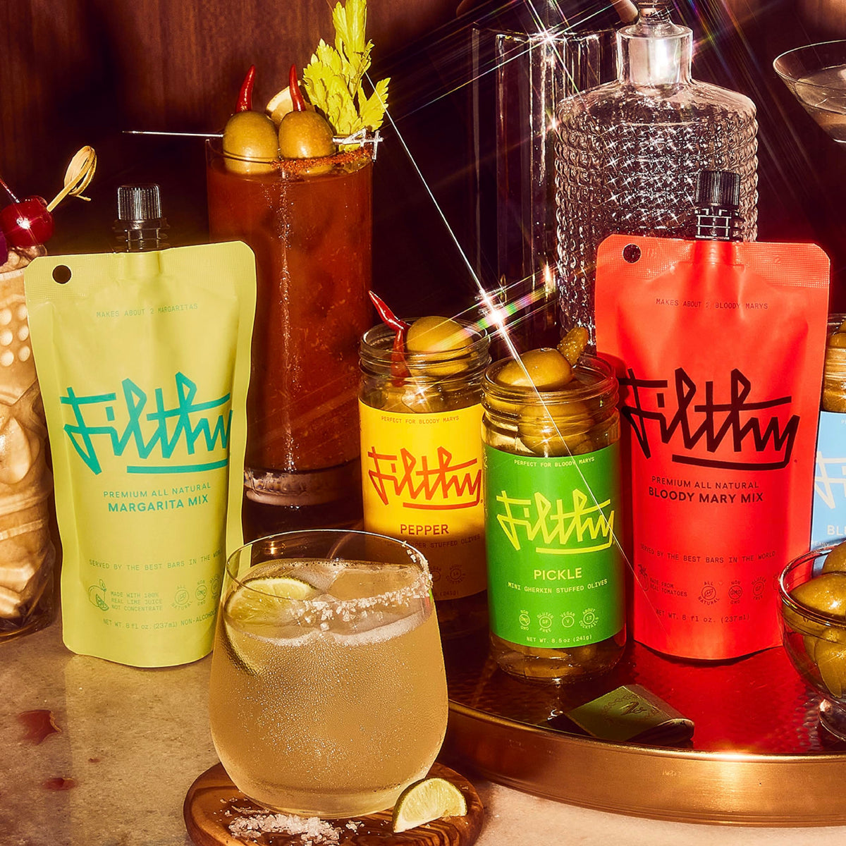 Filthy Food Margarita Mix being poured into a shaker for quick cocktails.