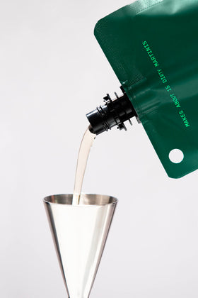 Filthy Food olive brine with martini setup ready for savory cocktails