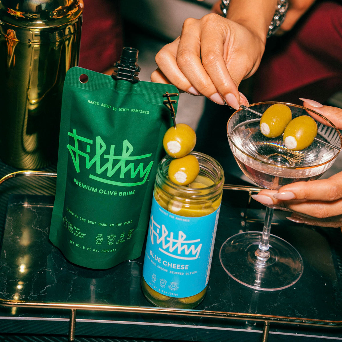 Filthy Food premium cocktail garnish olives, elevating home bartending with rich, savory blue cheese.