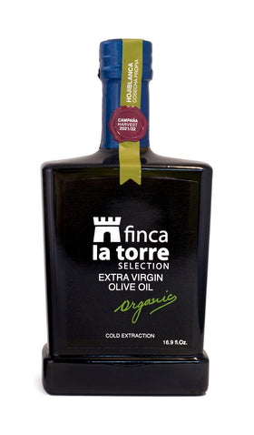 Pouring Finca La Torre Hojiblanca oil enhances dressings with fruity peppery notes