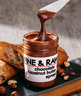 Fine & Raw spread on waffles, enhancing breakfast with cocoa flavor.