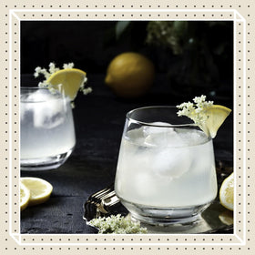 Pouring Finest Call elderflower syrup into a glass with a floral aroma