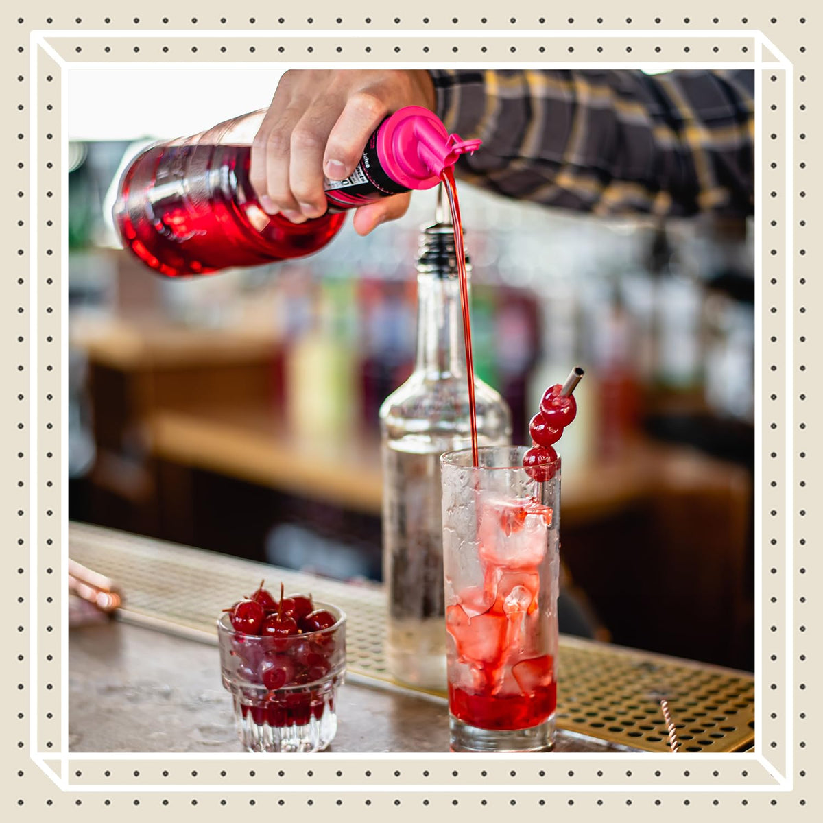 Finest Call grenadine in a cocktail glass for vibrant color and balanced sweetness.