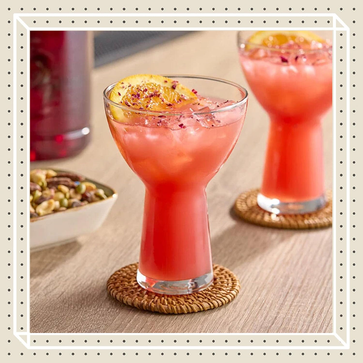Finest Call Hibiscus Syrup being poured into a glass for vibrant drinks.