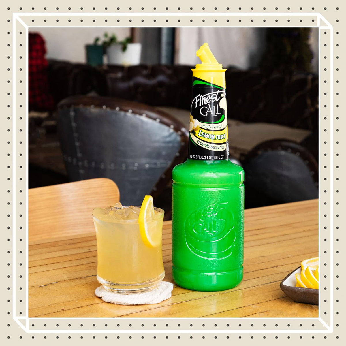 Pour-angle shot of lemon juice bottle ready for quick cocktail prep.