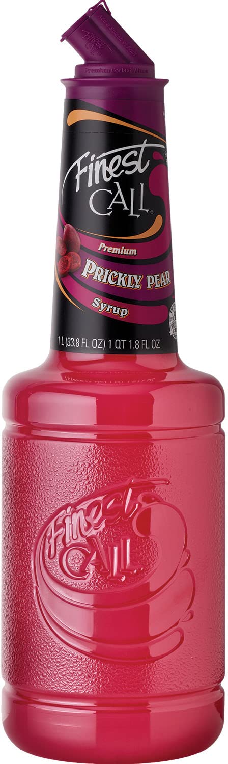 Finest Call prickly pear syrup bottle on a bar for vibrant cocktails.