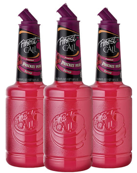 Finest Call Prickly Pear Syrup bottle on a bar, ideal for cocktails.