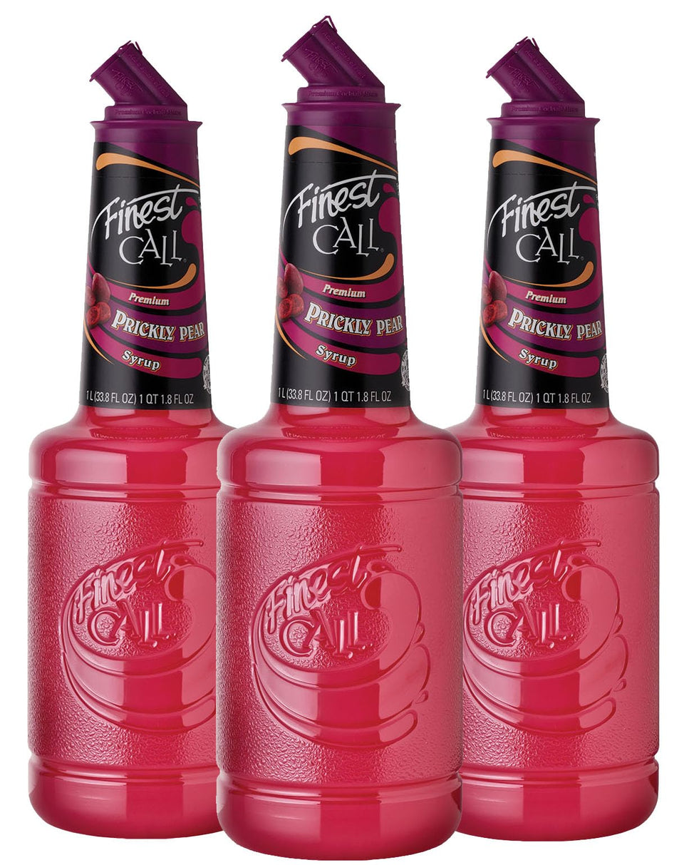 Finest Call Prickly Pear Syrup bottle on a bar, ideal for cocktails.