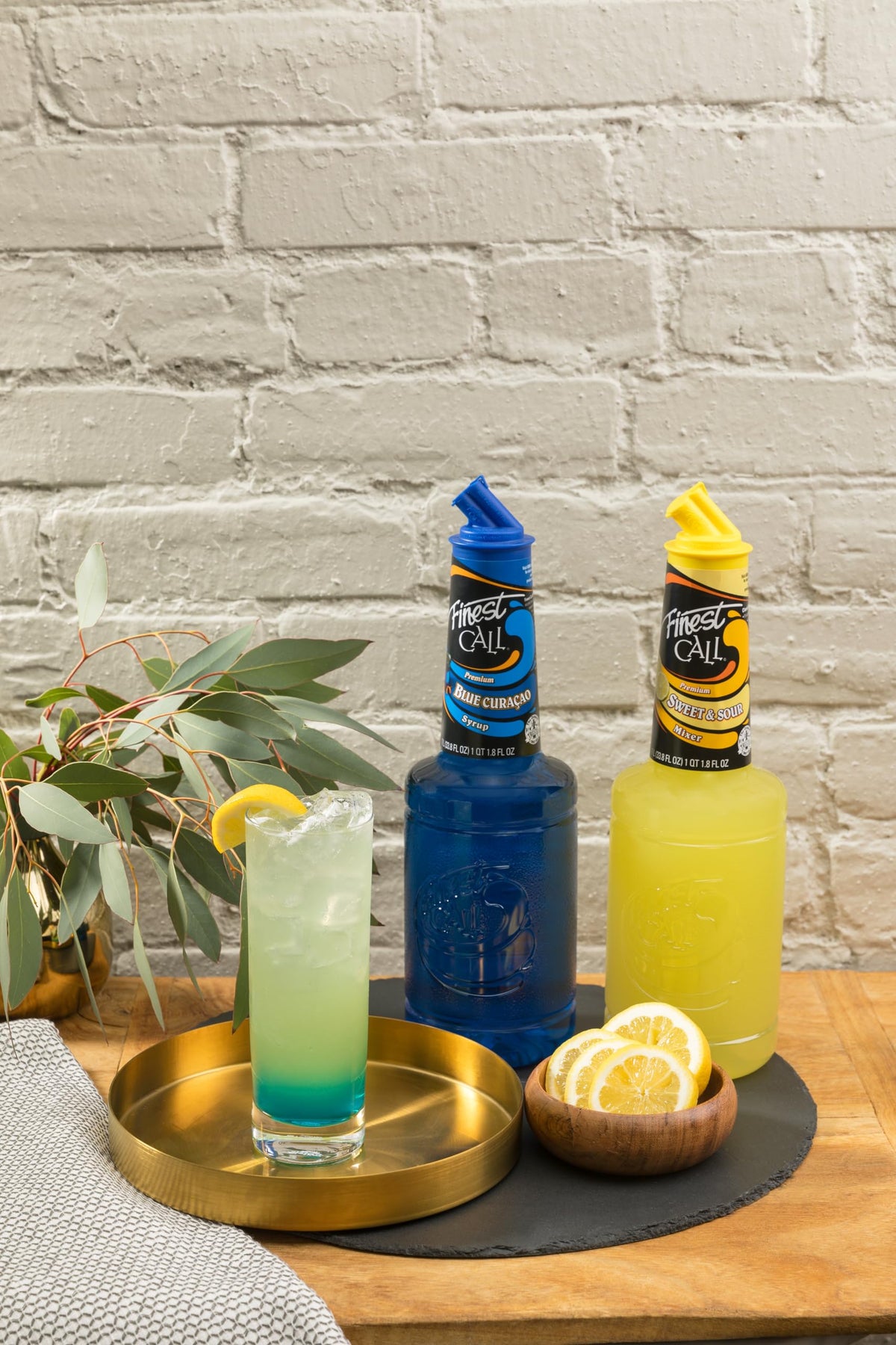 Finest Call Sweet & Sour Mix bottle pour for versatile, consistent cocktails.