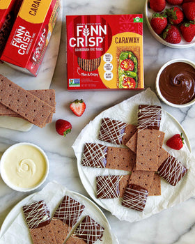Finn Crisp Caraway crispbread on a meat and cheese board for entertaining
