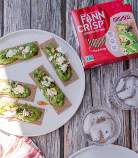 Lifestyle breakfast scene with Finn Crisp Sourdough Rye Thins and toppings.