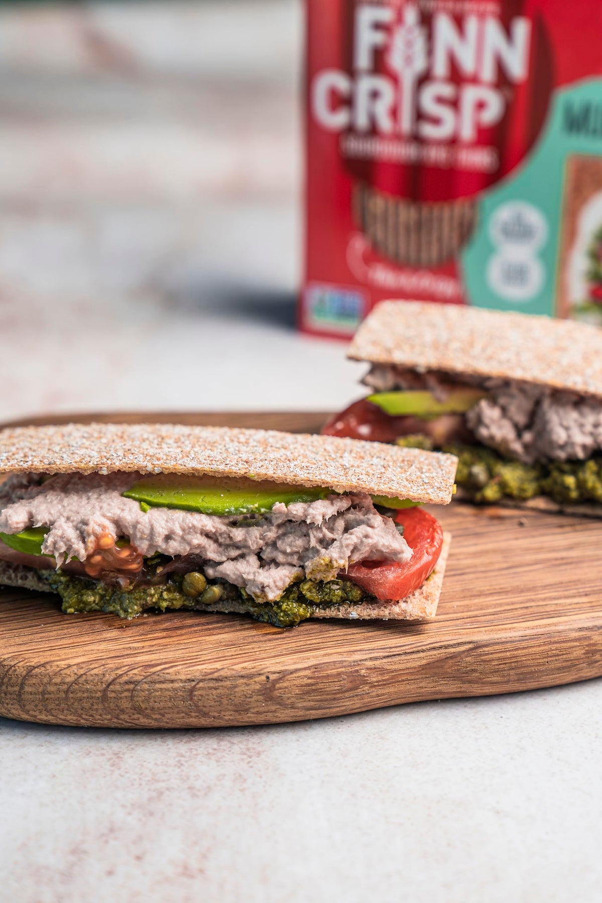 Finn Crisp multigrain crispbread on a charcuterie board with cheese and fruits