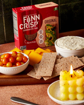 Finn Crisp Sourdough Rye Thins with toppings on a plate for a light meal.