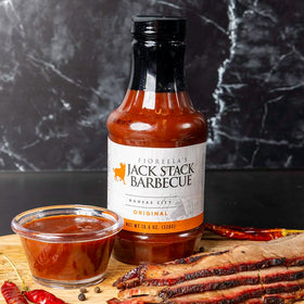 Brisket plated with Fiorella's Jack Stack Original Sauce finishing touch