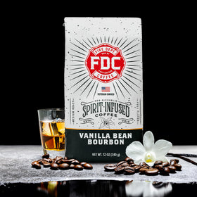 Roasted beans of Fire Department Coffee Vanilla Bourbon with deep caramel tones.