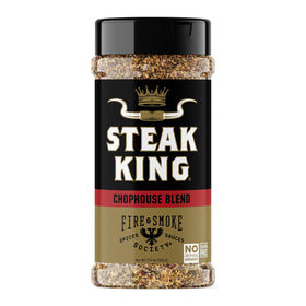 Fire & Smoke Society Steak King seasoning bottle on the counter for bold steak flavor.