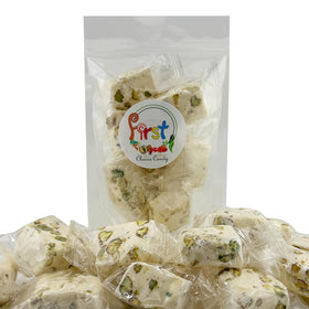 Soft, chewy nougat texture highlighted by pistachio crunch and sweetness.
