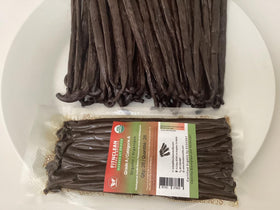 Closeup of FITNCLEAN vanilla beans showing oil sheen and texture for desserts.