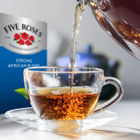 Steam rises from a cup of Five Roses African Blend for a comforting brew.