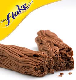 Cadbury Flake crumbling texture close-up reveals delicate flakes.