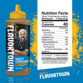 Flavortown Carolina Gold BBQ Sauce label closeup highlights gluten-free claim and mustard notes.