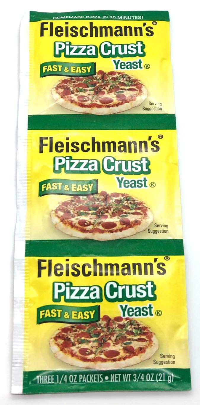 Dough being kneaded on a floured surface with Fleischmann's yeast.