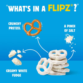 Open bag of Flipz white fudge pretzels spilling onto a snack table.