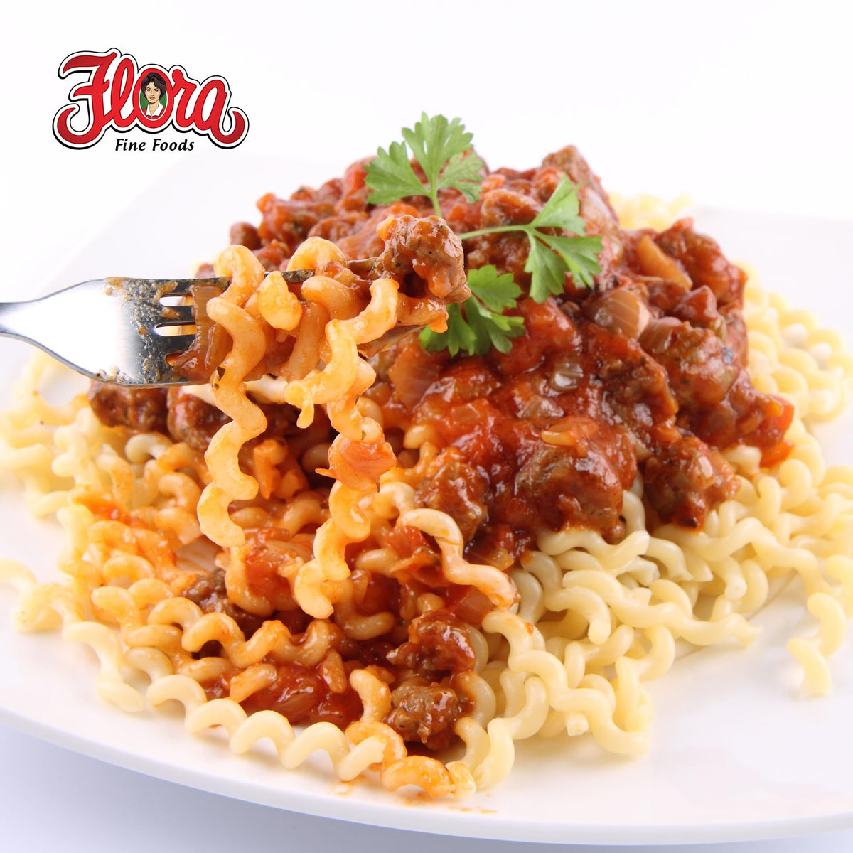 Flora Fine Foods raw fusilli lunghi shows golden organic durum wheat strands.