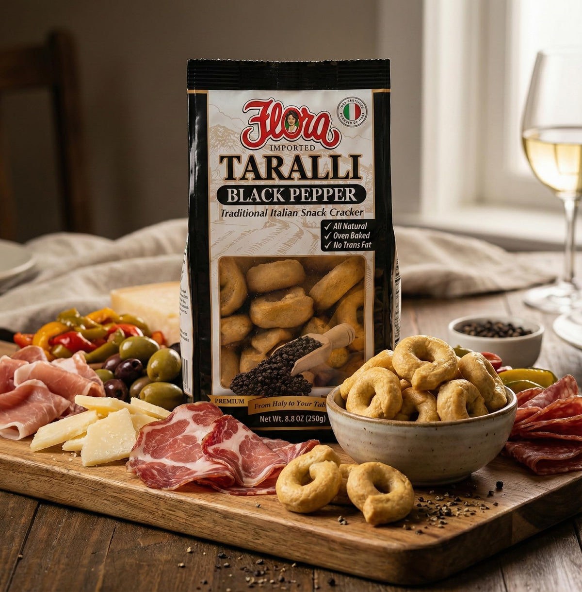 Flora Fine Foods taralli black pepper closeup texture highlights golden baked crunch.