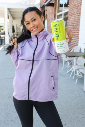 Flova 12-pack cans arranged for easy on-the-go hydration