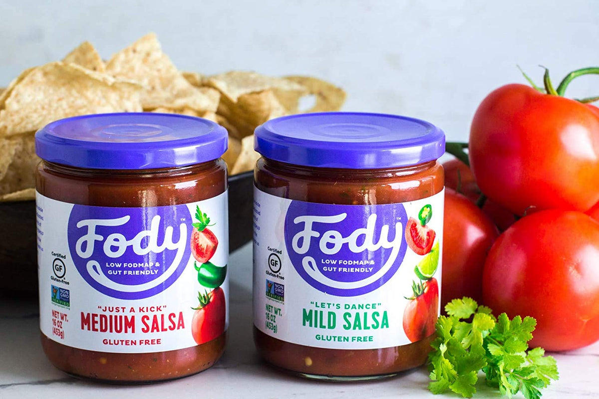 Fody Mild Salsa glass jar on counter, convenient pantry staple.