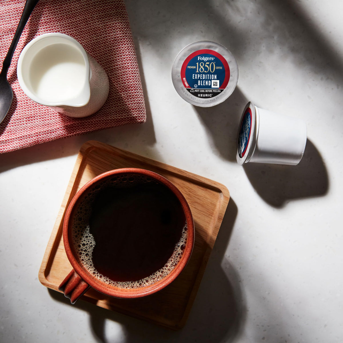 Folgers 1850 Expedition Blend K-Cups hero-pack on shelf for busy days.