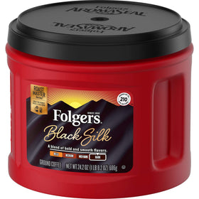 Steaming cup of Folgers Black Silk dark roast highlighting rich color.
