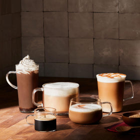 Folgers Black Silk dark roast pouring into a cup with aroma.