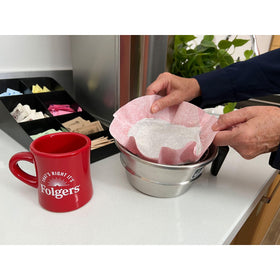 Folgers Classic Roast filter packs in brew basket deliver consistent flavor.