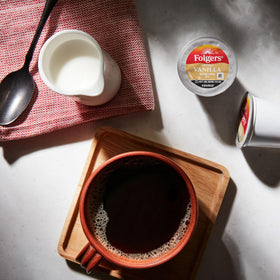 Folgers K-Cup pods on a counter ready for quick single-serve mornings.