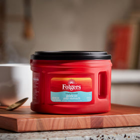 Folgers Simply Smooth aromaSeal lid closeup preserving freshness for flavorful brews.