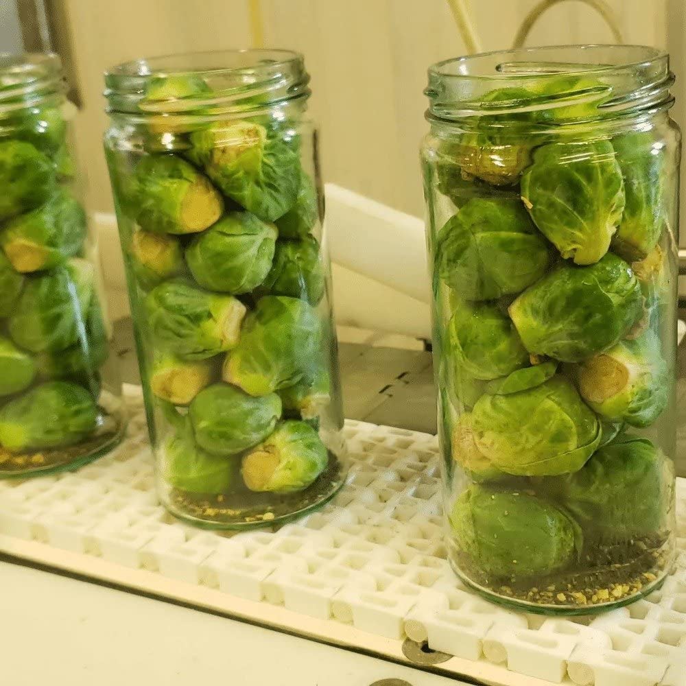 Foster's Pickled Brussels Sprouts presented in a dish with dips
