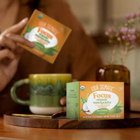Four Sigmatic matcha latte mix in a steaming cup, showcasing a dairy-free morning.