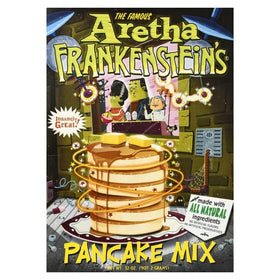 Pancakes cooking on a hot griddle using Aretha Frankenstein's mix.