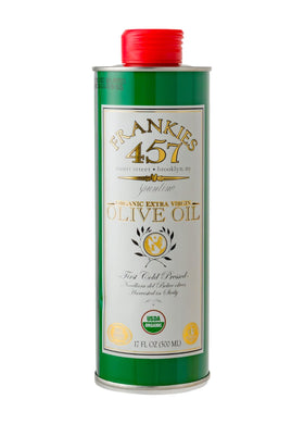 Frankies 457 Organic EVOO bottle pouring over vegetables to boost flavor.