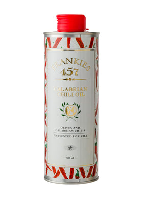 Frankies 457 Spicy Calabrian Chili Oil bottle pour showcases premium EVOO and bold heat for pasta and dressings