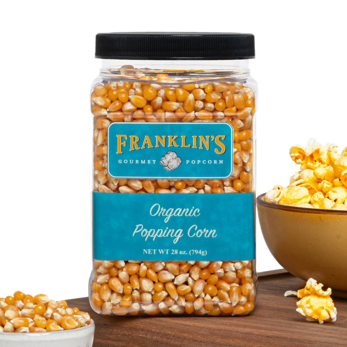 Franklin's Gourmet Popcorn Organic Kernels in a 28oz tub, ideal for theater-style popcorn.