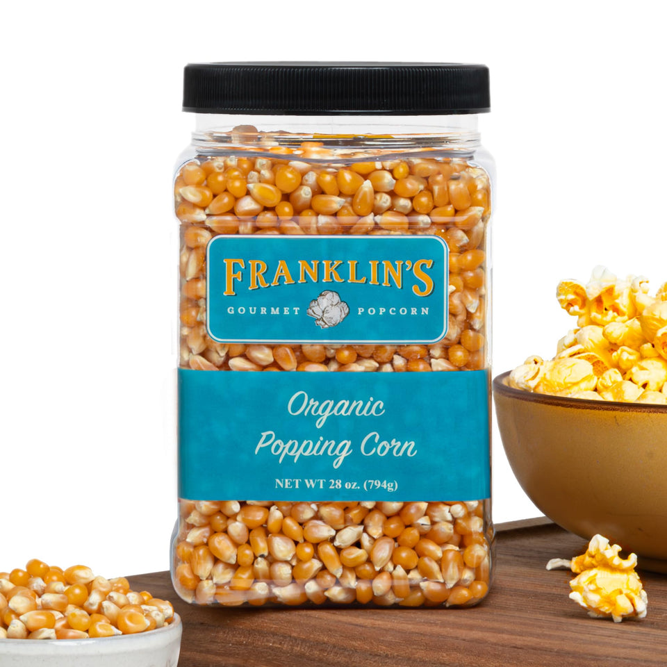 Franklin's Gourmet Popcorn Organic Kernels in a 28oz tub, ideal for theater-style popcorn.