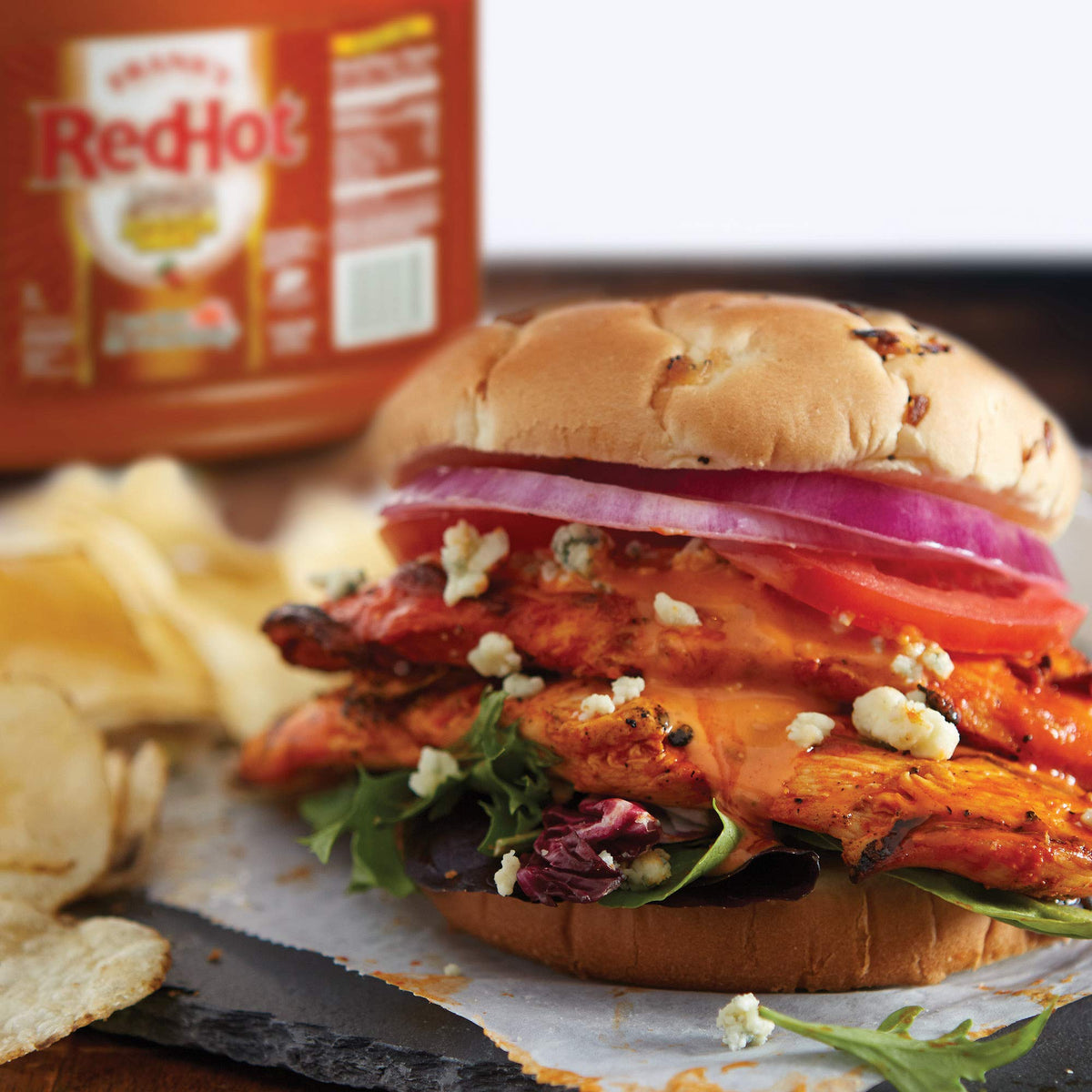 Frank's RedHot bottle beside vegetables to brighten a dish