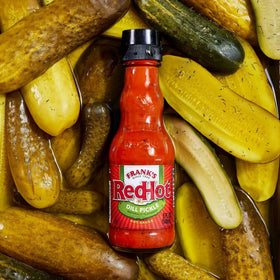 Wings topped with Frank's RedHot Dill Pickle Hot Sauce for tang