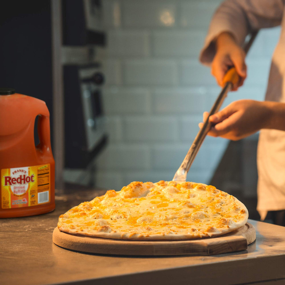 Kitchen-ready Frank's RedHot sauce bottle for fast prep