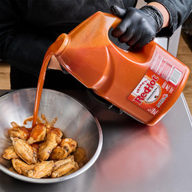 Golden fries topped with Frank's RedHot for bold flavor.