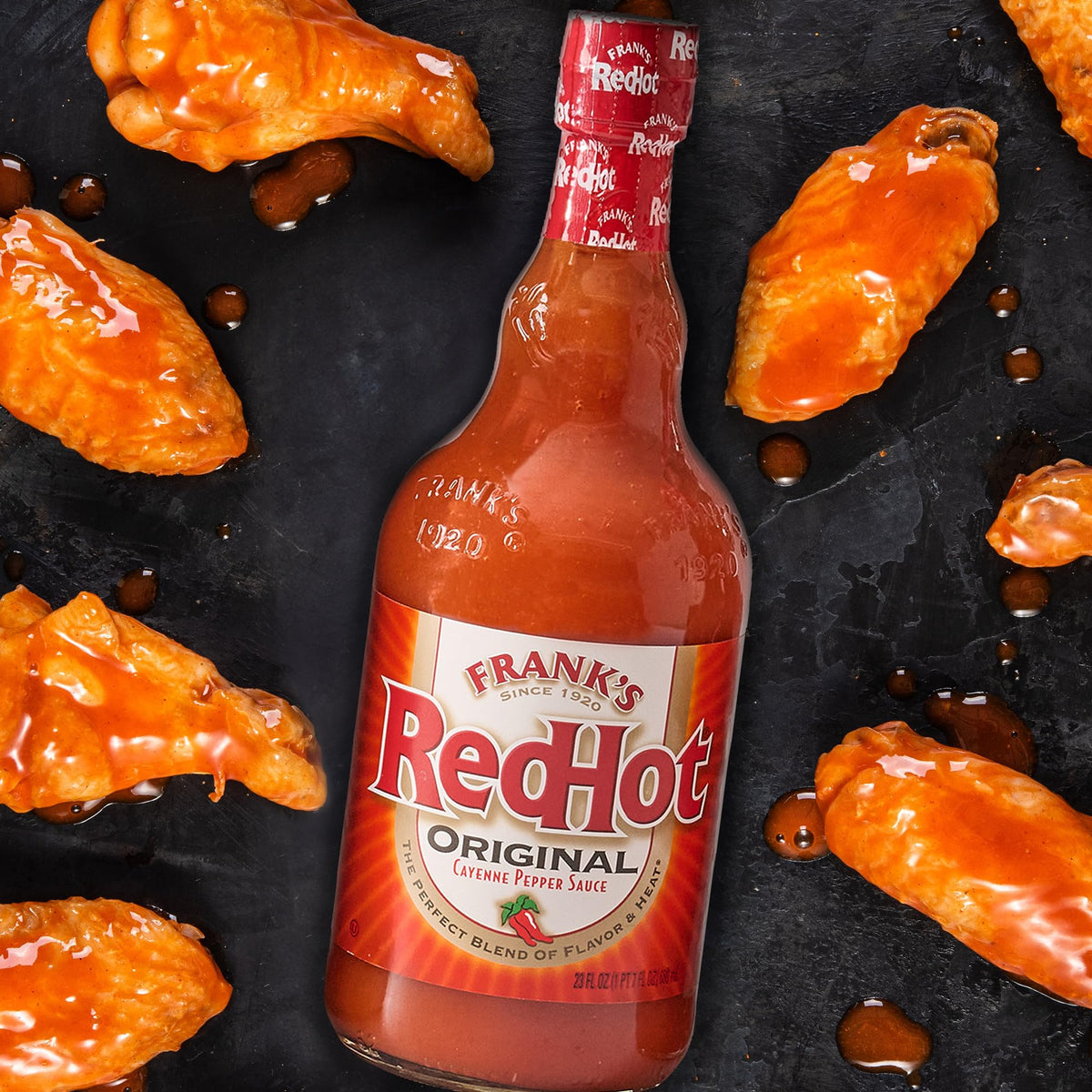 Kitchen counter setup with Frank's RedHot Original Cayenne Sauce and bowls