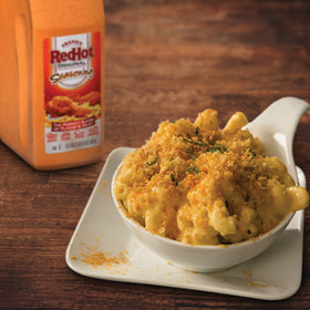 Franks RedHot Original Seasoning dust on pizza adds savory heat.
